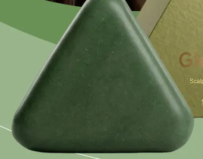 Green triangle-shaped scalp care shampoo bar